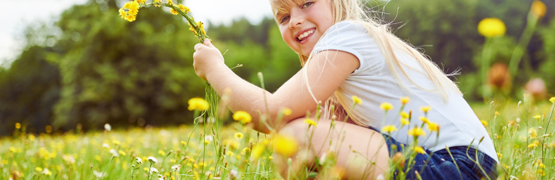 Child with flowers in a meadow
