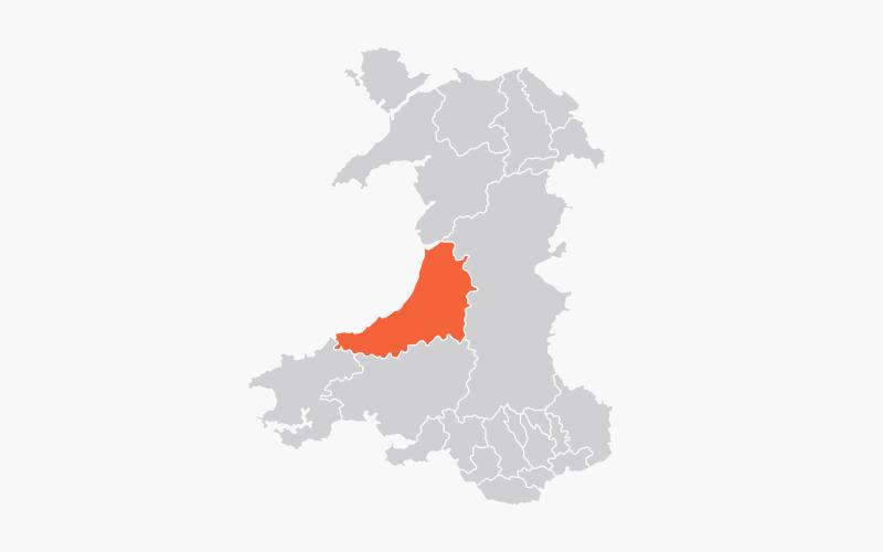 Map darluniedig yn dangos awdurdodau unedol Cymru, gyda Cheredigion wedi'i amlygu mewn oren.