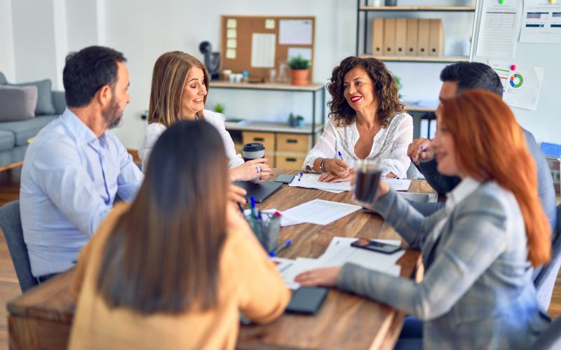 People interacting around a table