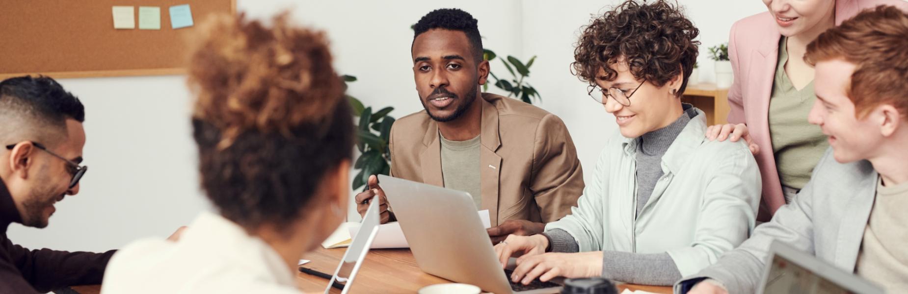 People working at a desk collaborating