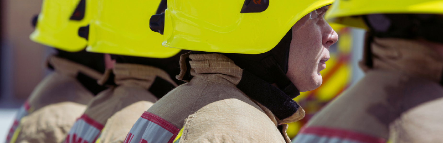 Row of fire fighters in uniform