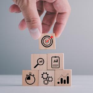 Hand stacking square wooden planning icons